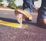 Gum stuck to man's shoe