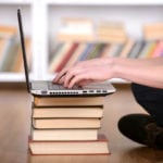 Laptop on a Pile of Books