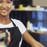 Woman With EMV Credit Card Reader