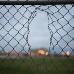 Chain link fence with a hole in it