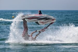 Person riding waterski upside down