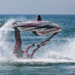 Person riding waterski upside down